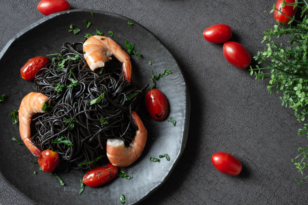 A plate of squid ink pasta