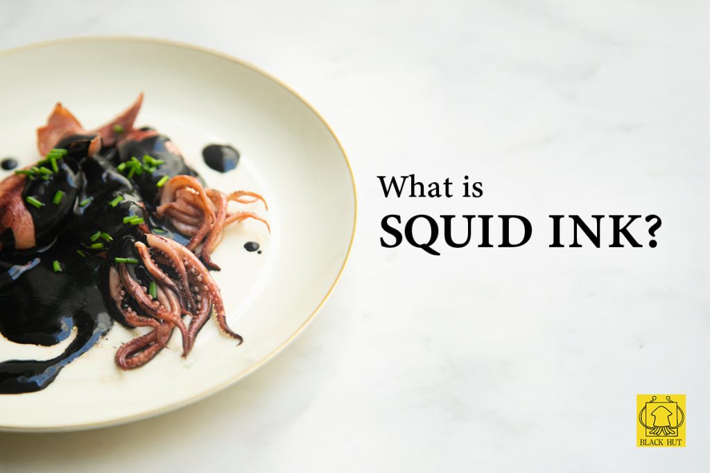What is squid ink - Plate of pasta with natural squid ink on white background