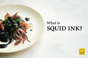 What is squid ink - Plate of pasta with natural squid ink on white background