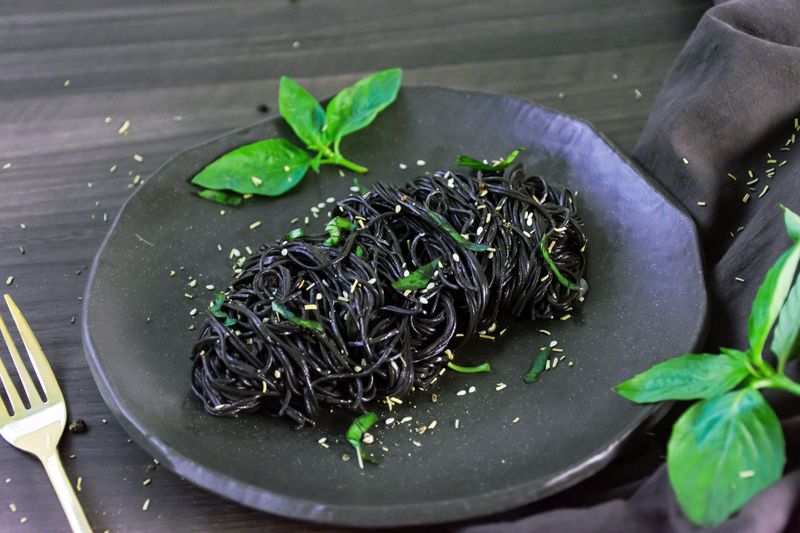 Squid ink pasta plated for fine dining